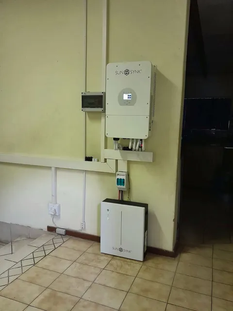 Wall-mounted inverter, battery and small distribution board installed in a room
